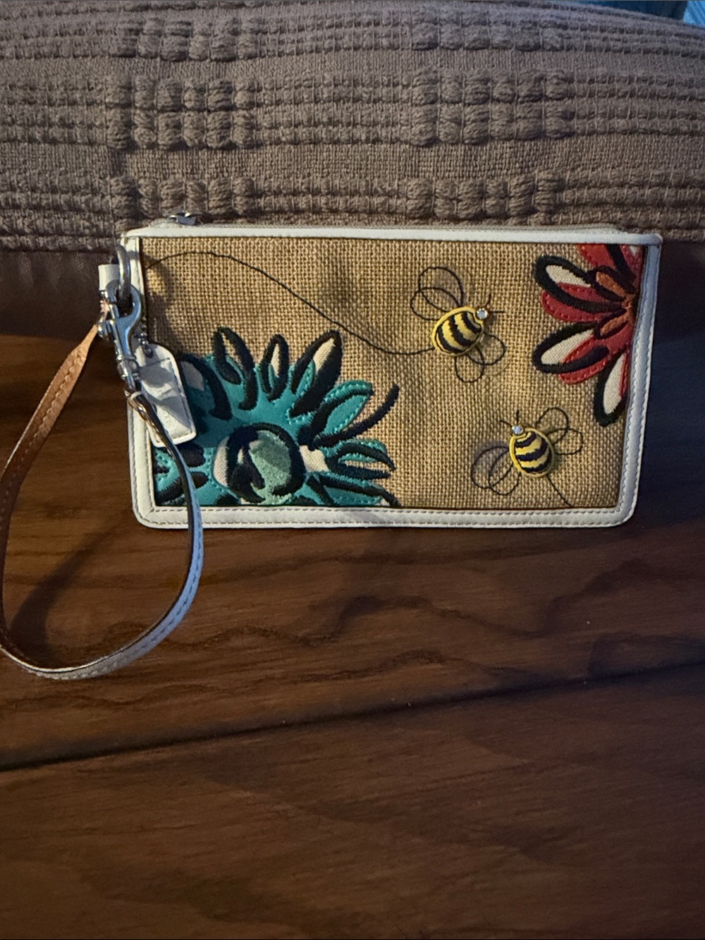 Coach Beige Canvas Wristlet with Turquoise & Black Appliqué